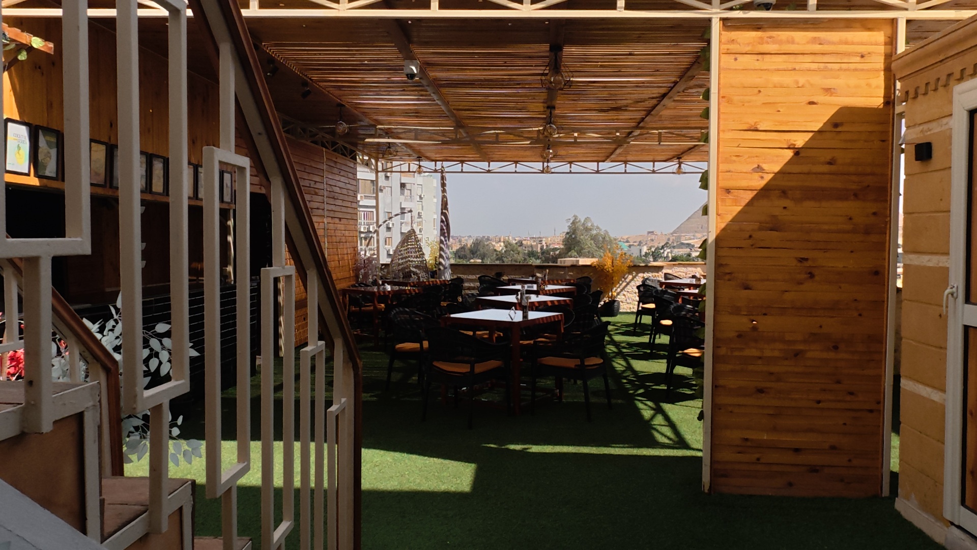 Wooden staircase leading up to the Grand View rooftop dining area